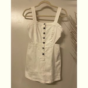 NEW. Skort romper with button up closure. White. Size 2.